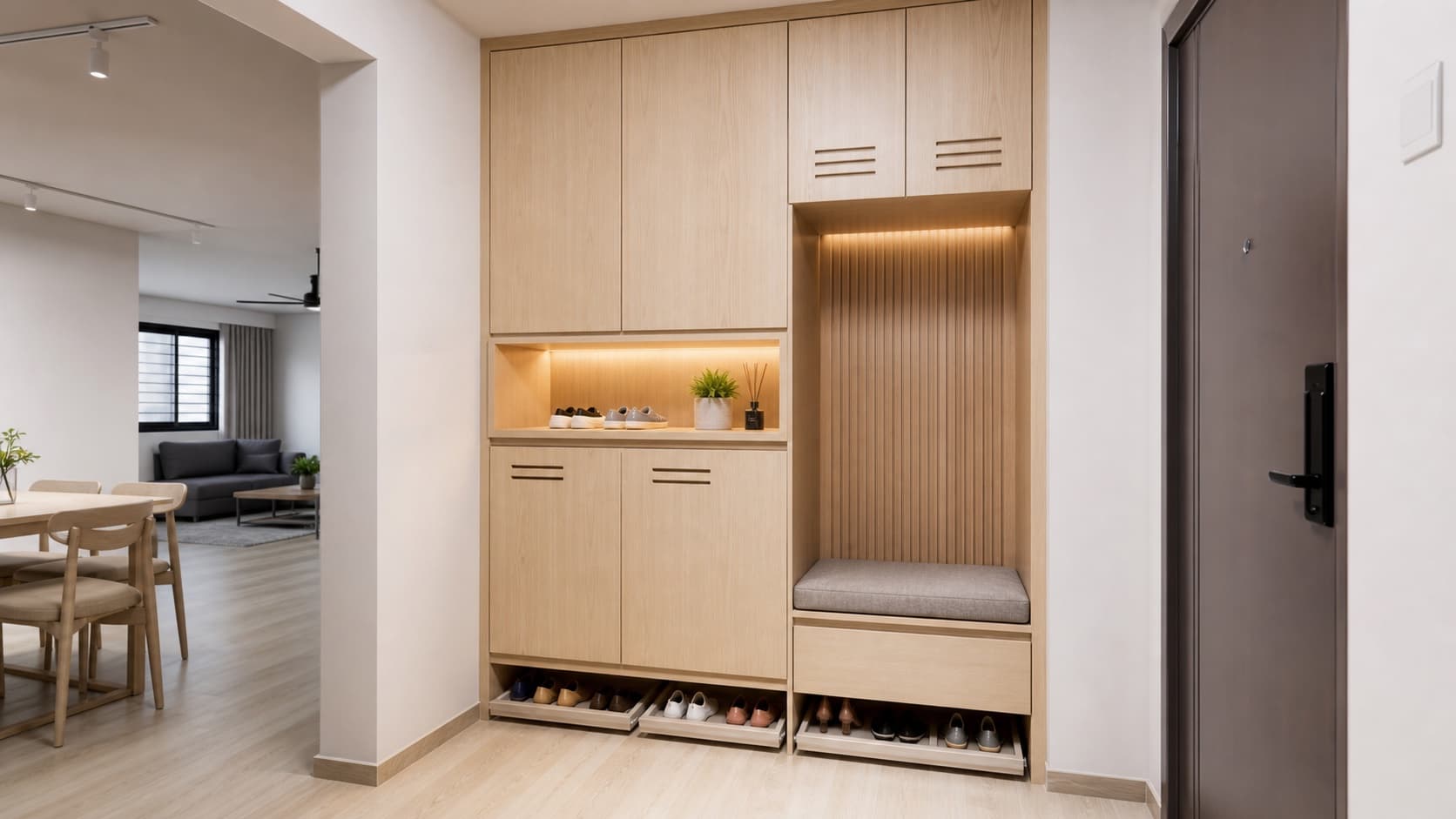 Built-in HDB foyer shoe cabinet with ventilated doors and a small bench